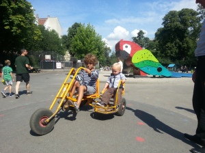 My son gets a ride in a Copenhagen playground - even the toys here promote cycle culture